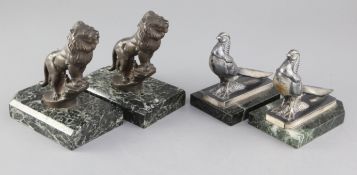 Maurice Frécourt. Two pairs of Art Deco bronzed and silvered metal bookends, roaring lions and Asian