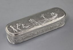 A late 19th century Hanau repousse silver ovoid box, with hinged lid and decorated with putti and