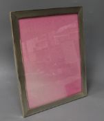 A 1960's engine turned silver rectangular photograph frame, 25.6cm.