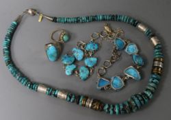 A group of assorted turquoise set jewellery comprising two rings, a bracelet and two necklaces.