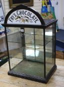 A Fry's chocolate advertising cabinet with printed opaque glass pediment