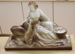 A large ceramic model of a lady and a deer, signed Polbert