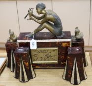 A 1930's faux tortoiseshell and faux mother-of-pearl spelter mounted figural clock garniture clock