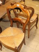 A set of six 19th century French stained beech rush seated dining chairs