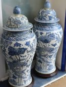 A pair Chinese 20th century blue and white large floor vases and covers, of baluster form, with