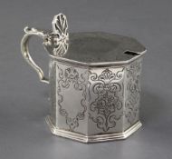 A Victorian silver octagonal mustard by The Barnards, with engraved decoration and blue glass liner,