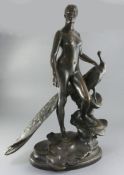 Alexander Falguiere. A bronze group of a nude woman standing beside a peacock, on signed