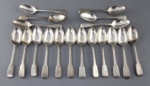 A set of eighteen George III silver fiddle pattern dessert spoons, Eley, Fearn & Chawner, with