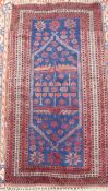 A Turkish blue and red rug, woven with a hexagonal medallion 184 x 185cm