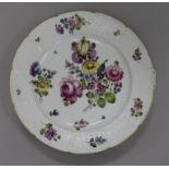 A German Meissen style dish, painted with floral bouquets