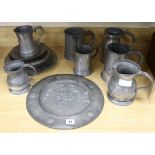 A collection of 18th and 19th century pewter mugs, a dish, etc.