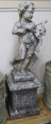 A weathered reconstituted stone garden figure of Cupid with bow and quiver of arrows, on square