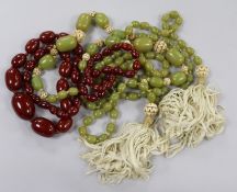 Three assorted simulated amber bead necklaces.