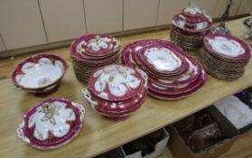 A late 19th/early 20th century large dinner service, bordered and gilded