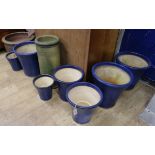 Seven dark blue glazed garden planters, an earthenware planter and a terracotta chimney pot (9)