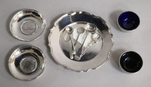 A 1970's silver stand, two white metal dishes inset with coins, a pair of Victorian silver salts and