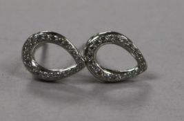 A modern pair of platinum and diamond ovoid openwork earrings, 10mm.