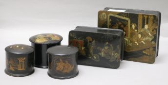 A group of five papier mache boxes