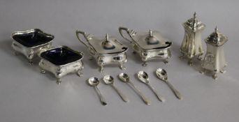 An early 20th century six piece silver condiment set, Birmingham, 1908/11 and six associated