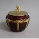 A modern Theo faberge silver gilt lidded ruby glass jar, with ballerinas finial, Birmingham, 2001,