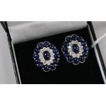 A pair of Walsh Bros. 18ct white gold, diamond and cabochon sapphire oval earclips, 20mm.