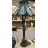 A pair of figural lamps with stained glass shades overall height 96cm