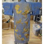 A heavily embroidered dragon designed kimono