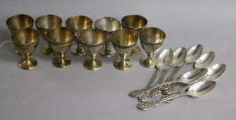 Ten mid 19th century French silver egg cups, Henri-Louis Chenailler, Paris, surmounted with the