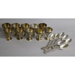 Ten mid 19th century French silver egg cups, Henri-Louis Chenailler, Paris, surmounted with the