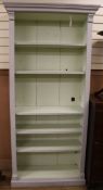 A 19th century painted open bookcase W.99cm