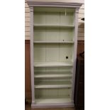 A 19th century painted open bookcase W.99cm