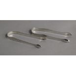 A pair of George III Hester Bateman bright cut engraved silver sugar tongs and a pair of similar