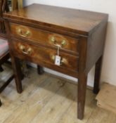 A George III mahogany two drawer side table, on square supports W.67cm