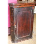 A dark wood corner cupboard W.71cm