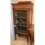 An Edwardian banded mahogany glazed bookcase W.61cm