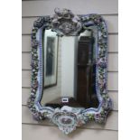 A Dresden flower encrusted wall mirror