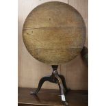 A george III oak tripod table. W.71cm