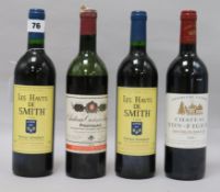 A bottle of Yon-Figeac, St. Emilion, 1998, two bottles of Les Haut de Smith, Pessac-Leognan, 1990