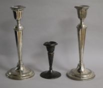 A pair of George V silver candlesticks, William Hutton & Sons, Birmingham, 1914/5 and one other