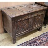 A carved oak coffer W.101cm