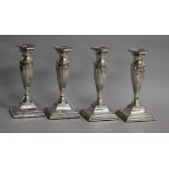 A set of four Edwardian fluted silver candlesticks, Marks & Cohen, Birmingham, 1906, weighted, 16.