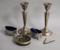 A pair of silver candlesticks (a.f.), pair of silver salts, a silver mounted hardstone dish and a