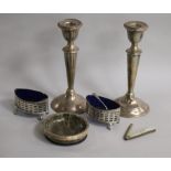 A pair of silver candlesticks (a.f.), pair of silver salts, a silver mounted hardstone dish and a