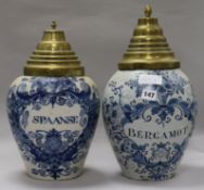 Two Dutch delft drug jars "Spanse" and "Bergomot", with brass covers height 37cm