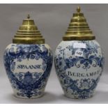 Two Dutch delft drug jars "Spanse" and "Bergomot", with brass covers height 37cm