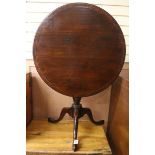 A George III mahogany circular tilt top tea table W.76cm