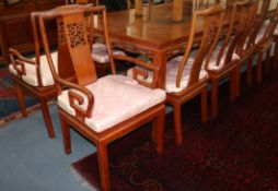 A set of eleven Chinese hardwood dining chairs