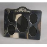 A modern silver mounted photograph frame with five oval apertures, London, 1989, width 21.7cm.