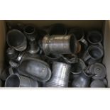 A collection of 18th and 19th century pewter mugs, cream jugs, etc.
