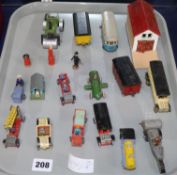 A group of nineteen late 1920's painted wooden models, including a garage building with ramp, a